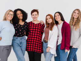A diverse group of girls smiling together, representing individuality and unique names in the new generation.