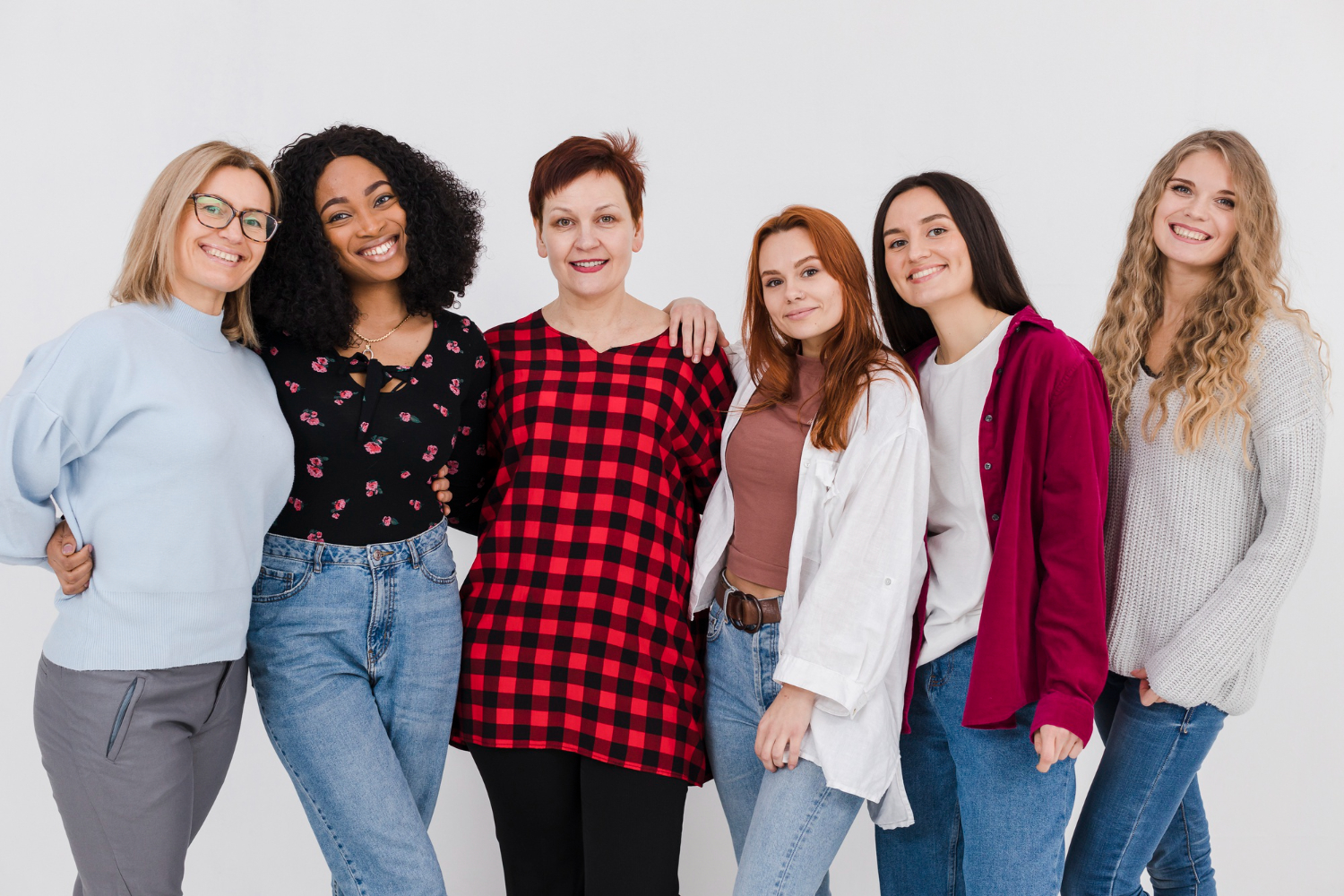 A diverse group of girls smiling together, representing individuality and unique names in the new generation.